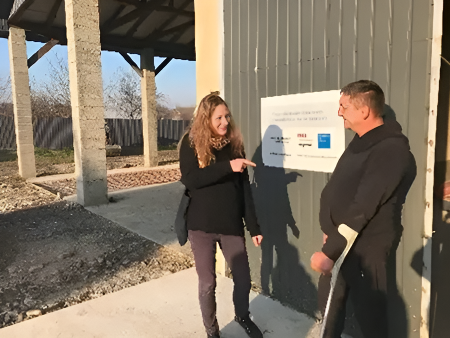 Karine Meaux in front of a store house in Nyzhnie Selyshch, Ukraine with farming equipment for the villagers built thanks to funding form Fondation de France, Credit_Fondation de France_enhanced